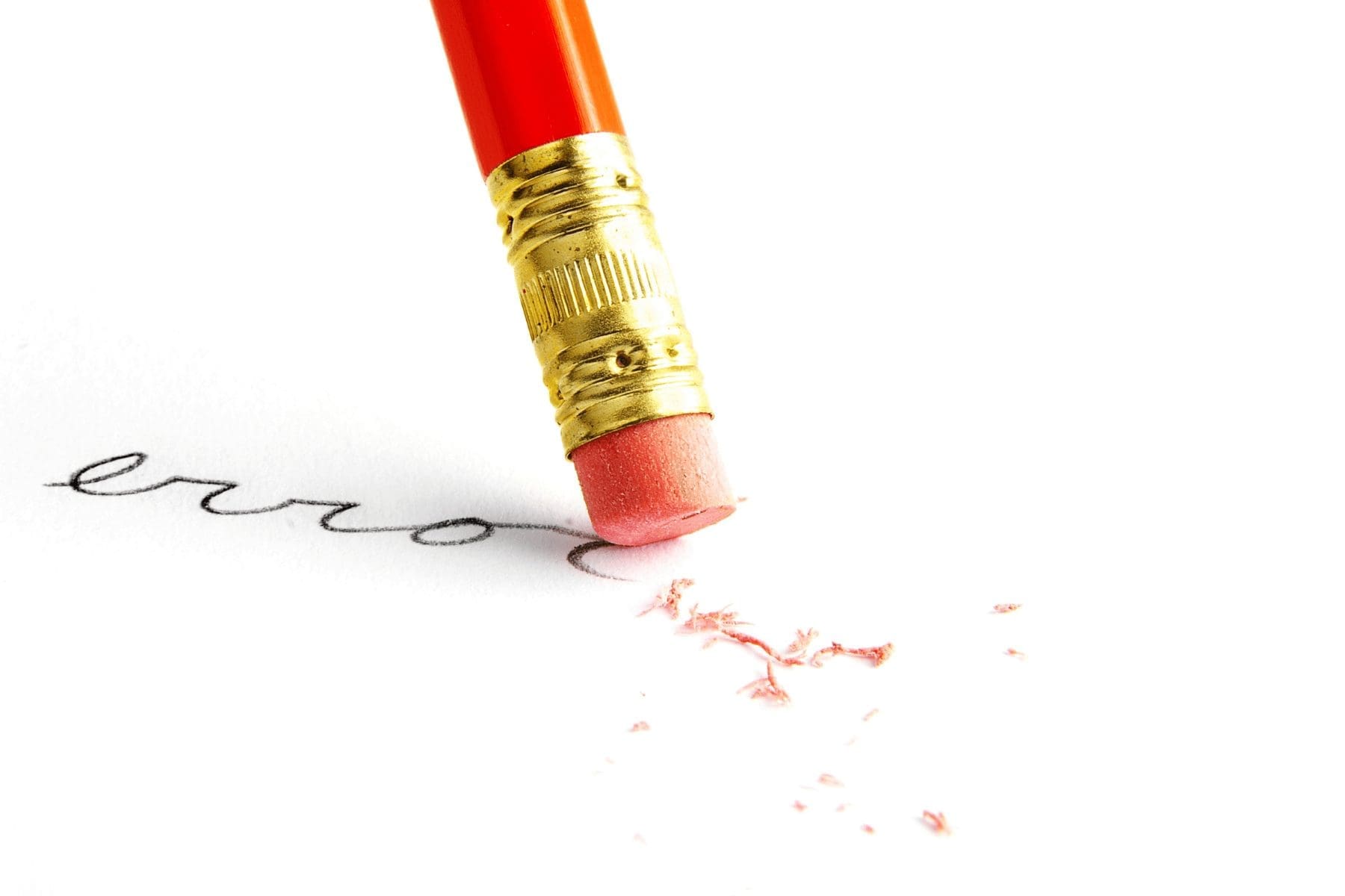a pencil erasing errors on a paper
