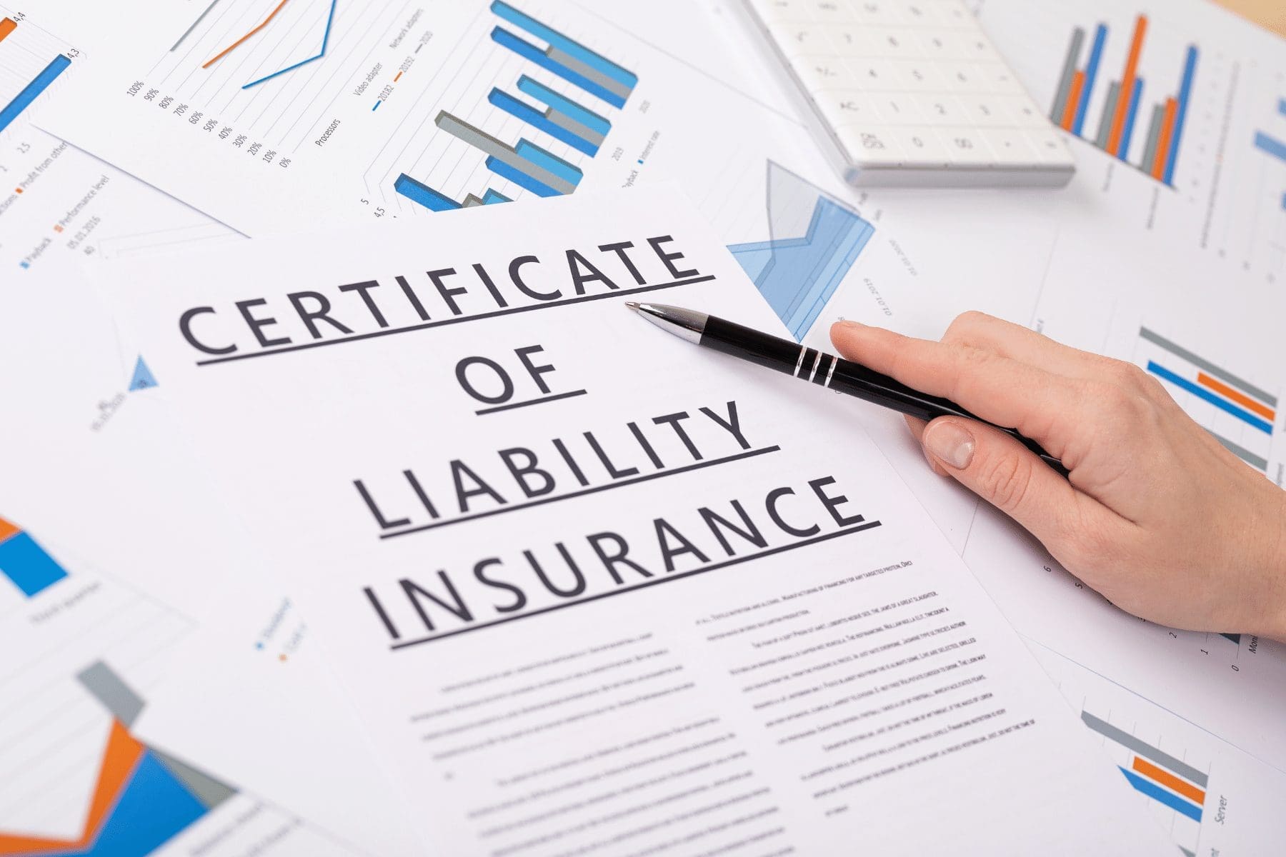 a person pointing to a certificate of insurance